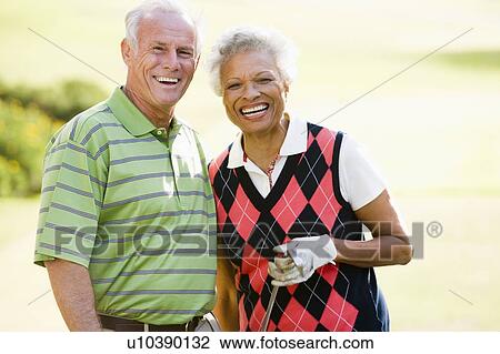 Couple Enjoying A Game Of Golf View Large Photo Image Stock Image - Couple Enjoying A Game Of Golf. Fotosearch