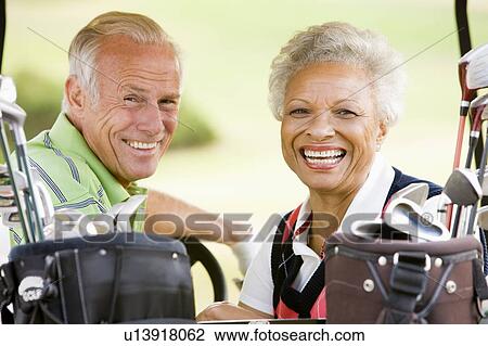 Couple Enjoying A Game Of Golf View Large Photo Image Stock Image - Couple Enjoying A Game Of Golf. Fotosearch
