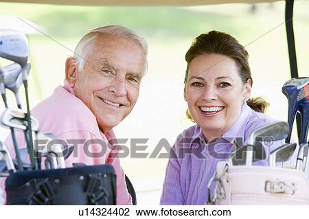 Couple Enjoying A Game Of Golf View Large Photo Image Stock Image - Couple Enjoying A Game Of Golf. Fotosearch
