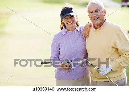 Couple Enjoying A Game Of Golf View Large Photo Image Stock Photograph - Couple Enjoying A Game Of Golf. Fotosearch
