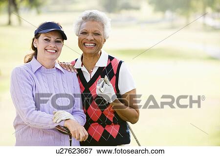 Female Friends Enjoying A Game Of Golf View Large Photo Image Stock Photo - Female Friends Enjoying A Game Of Golf. Fotosearch