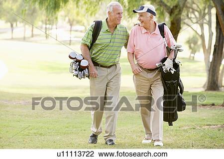 Male Friends Enjoying A Game Of Golf View Large Photo Image Stock Image - Male Friends Enjoying A Game Of Golf. Fotosearch