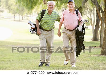 Male Friends Enjoying A Game Of Golf View Large Photo Image Stock Image - Male Friends Enjoying A Game Of Golf. Fotosearch