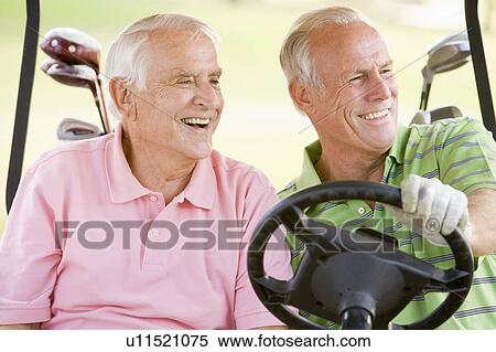 Stock Photography - Male Friends Enjoying A Game Of Golf. Fotosearch