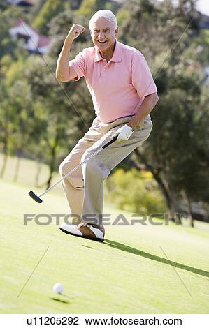 Stock Image - Man Playing A Game Of Golf. Fotosearch