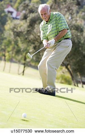Man Playing A Game Of Golf View Large Photo Image Stock Image - Man Playing A Game Of Golf. Fotosearch