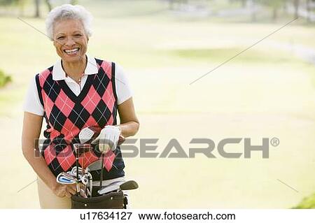 Stock Photo - Portrait Of A Female Golfer. Fotosearch