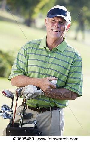 Stock Photo - Portrait Of A Male Golfer. Fotosearch