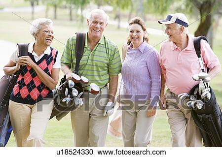 Stock Image - Portrait Of Four Friends Enjoying A Game Golf. Fotosearch