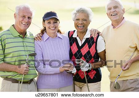 Stock Image - Portrait Of Four Friends Enjoying A Game Golf. Fotosearch