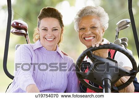 Stock Image - Portrait Of Two Female Golfers. Fotosearch