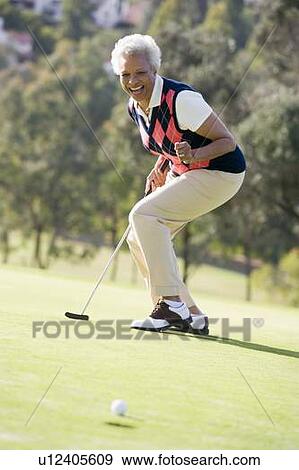 Stock Photo - Woman Playing A Game Of Golf. Fotosearch