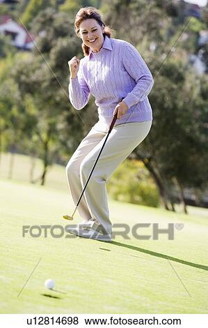 Woman Playing A Game Of Golf View Large Photo Image Stock Photo - Woman Playing A Game Of Golf. Fotosearch