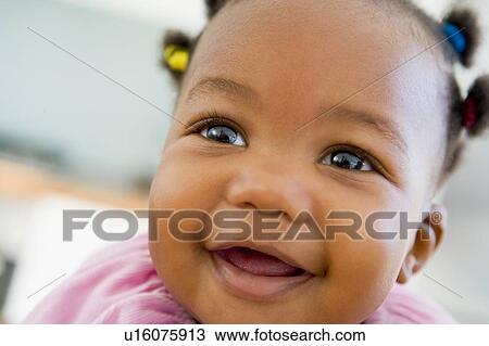 Baby indoors smiling View Large Photo Image Stock Image - Baby indoors smiling. Fotosearch