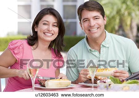 Couple Enjoying A Barbequed Meal In The Garden View Large Photo Image Stock Image - Couple Enjoying A Barbequed Meal In The Garden. Fotosearch