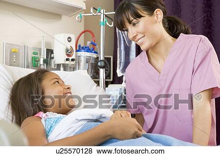Stock Photo - Nurse Talking To Young Patient. Fotosearch