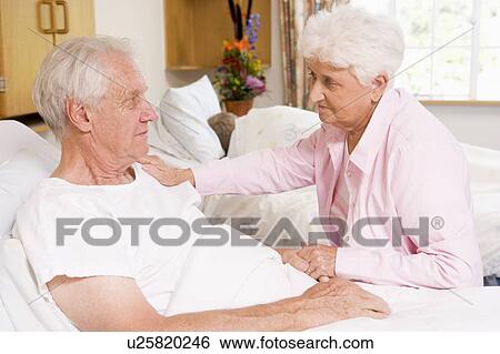 Senior Couple Sitting In Hospital View Large Photo Image Stock Photograph - Senior Couple Sitting In Hospital. Fotosearch