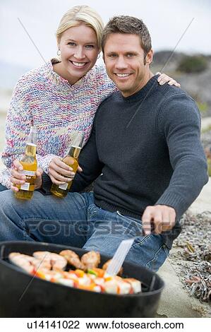 Couple Cooking On A Barbeque View Large Photo Image Stock Image - Couple Cooking On A Barbeque. Fotosearch
