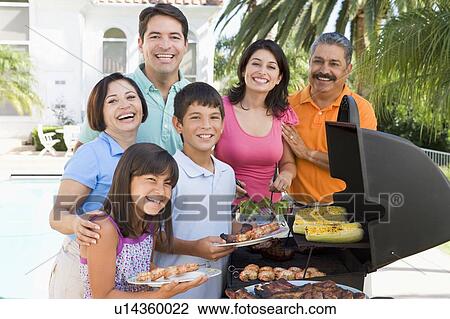 Family Enjoying A Barbeque View Large Photo Image Stock Image - Family Enjoying A Barbeque. Fotosearch