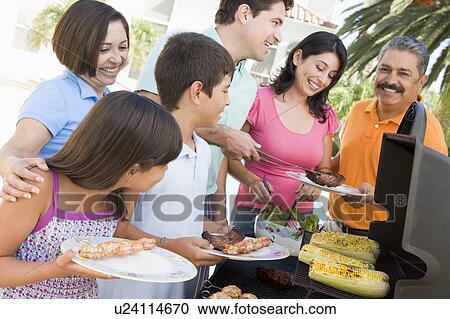 Family Enjoying A Barbeque View Large Photo Image Stock Image - Family Enjoying A Barbeque. Fotosearch