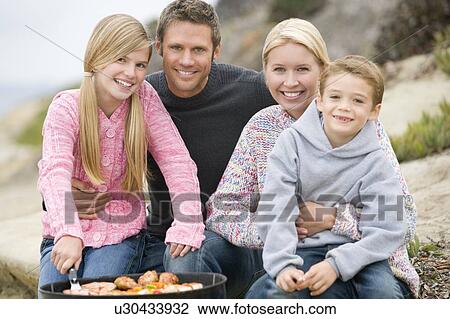 Family Enjoying A Barbeque View Large Photo Image Stock Image - Family Enjoying A Barbeque. Fotosearch