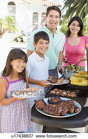 Family Enjoying A Barbeque View Large Photo Image Stock Photo - Family Enjoying A Barbeque. Fotosearch