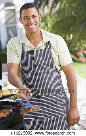 Man Barbequing In A Garden View Large Photo Image Stock Image - Man Barbequing In A Garden. Fotosearch