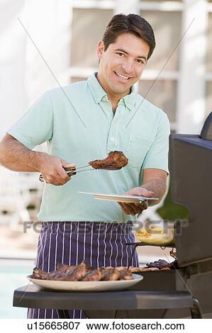 Man Barbequing In A Garden View Large Photo Image Stock Photo - Man Barbequing In A Garden. Fotosearch