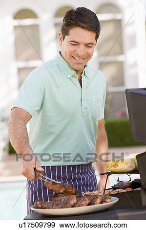 Man Barbequing In A Garden View Large Photo Image Stock Photo - Man Barbequing In A Garden. Fotosearch