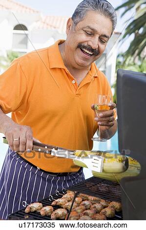 Man Barbequing In A Garden View Large Photo Image Stock Photography - Man Barbequing In A Garden. Fotosearch