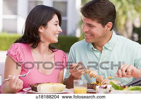 Picture - Family Enjoying A Barbeque. Fotosearch