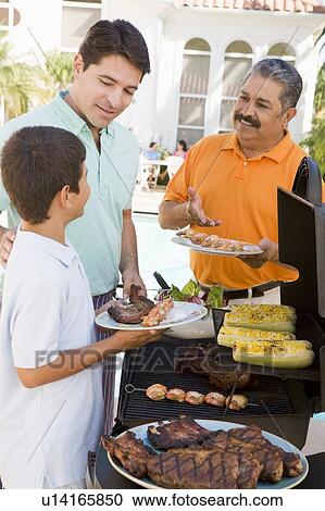 Family Enjoying A Barbeque View Large Photo Image Stock Image - Family Enjoying A Barbeque. Fotosearch