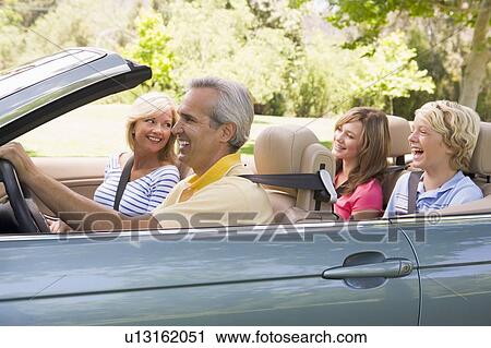 Family in convertible car smiling View Large Photo Image Stock Image - Family in convertible car smiling. Fotosearch