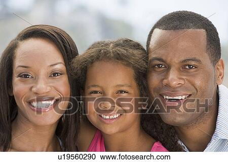 Family outdoors smiling View Large Photo Image Stock Image - Family outdoors smiling. Fotosearch
