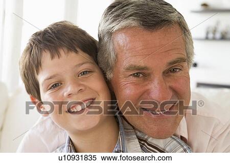 Grandfather and grandson indoors smiling View Large Photo Image Stock Photography - Grandfather and grandson indoors smiling. Fotosearch