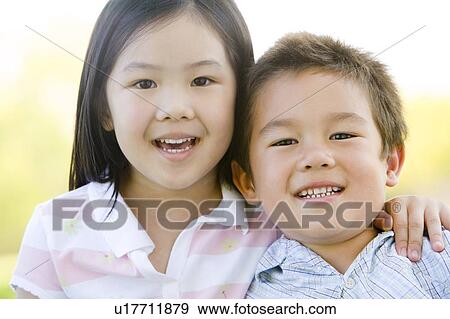 Brother and sister outdoors smiling View Large Photo Image Stock Photo - Brother and sister outdoors smiling. Fotosearch