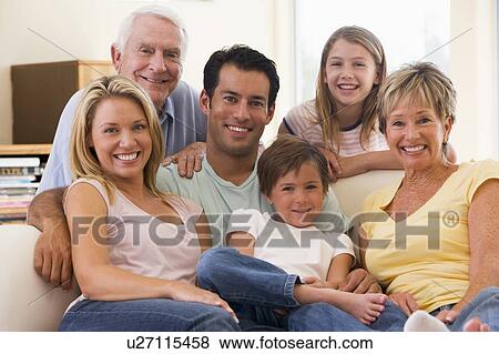Extended family in living room smiling View Large Photo Image Stock Photo - Extended family in living room smiling. Fotosearch
