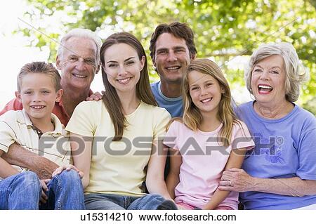 Extended family outdoors smiling View Large Photo Image Stock Image - Extended family outdoors smiling. Fotosearch