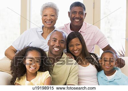 Extended family sitting on sofa View Large Photo Image Stock Photography - Extended family sitting on sofa. Fotosearch