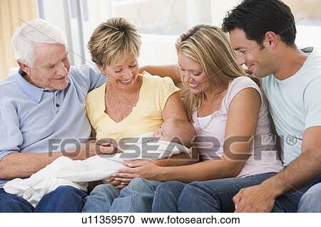 Family in living room with baby smiling View Large Photo Image Stock Image - Family in living room with baby smiling. Fotosearch