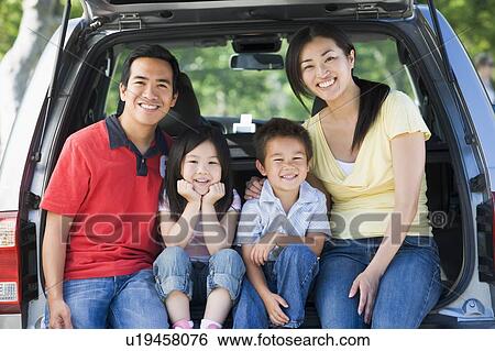 Family sitting in back of van smiling View Large Photo Image Stock Photograph - Family sitting in back of van smiling. Fotosearch
