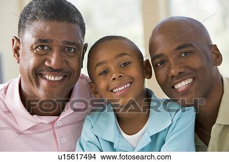 Picture - Grandfather with adult son and grandchild. Fotosearch