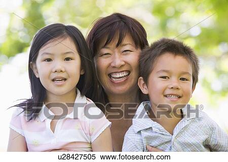 Grandmother laughing with grandchildren. View Large Photo Image Stock Photography - Grandmother laughing with grandchildren.. Fotosearch