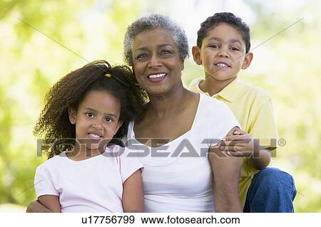 Grandmother posing with grandchildren. View Large Photo Image Stock Photo - Grandmother posing with grandchildren.. Fotosearch