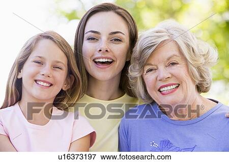 Grandmother with adult daughter and grandchild in park View Large Photo Image Stock Photo - Grandmother with adult daughter and grandchild in park. Fotosearch
