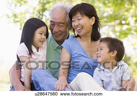 Grandparents laughing with grandchildren. View Large Photo Image Stock Image - Grandparents laughing with grandchildren.. Fotosearch