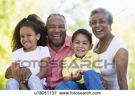 Grandparents laughing with grandchildren. View Large Photo Image Stock Photo - Grandparents laughing with grandchildren.. Fotosearch