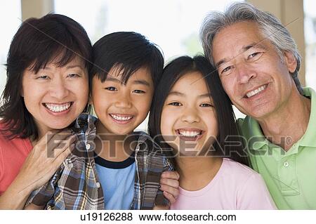 Stock Photo - Grandparents posing with grandchildren.. Fotosearch