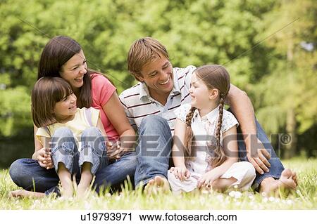 Family outdoors smiling View Large Photo Image Stock Image - Family outdoors smiling. Fotosearch