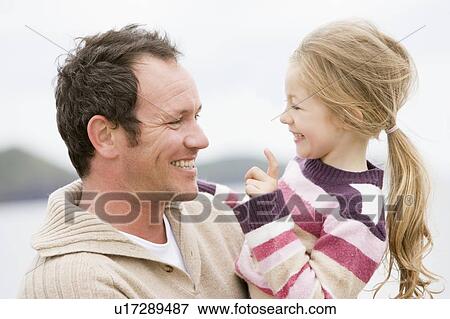 Father and daughter at beach smiling View Large Photo Image Stock Photo - Father and daughter at beach smiling. Fotosearch